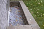 a retaining wall around a basement window
